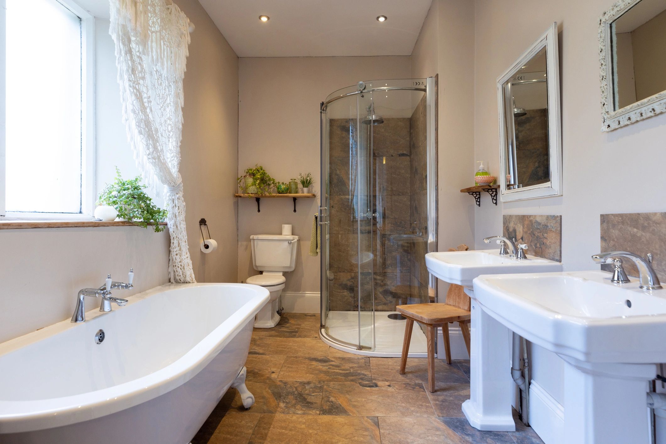 Neutral bathroom with tub and double vanity