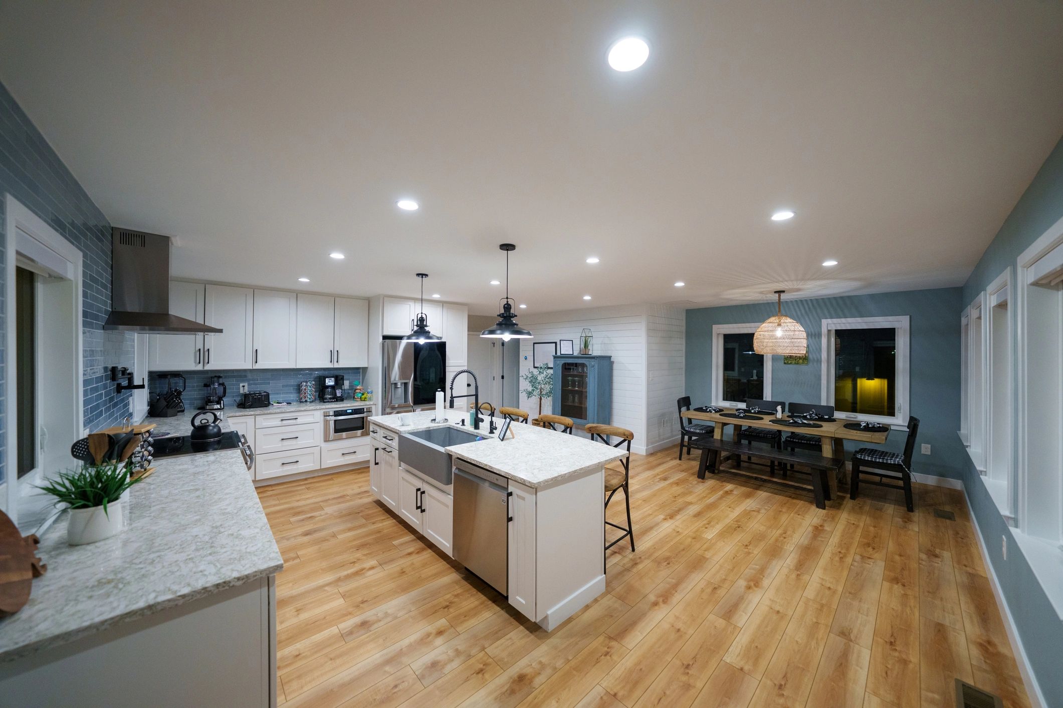 Modern farmhouse kitchen with island and dining area